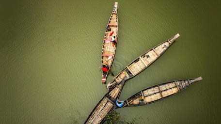 Three boats on the water wallpaper