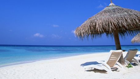 Blue water and white sand wallpaper
