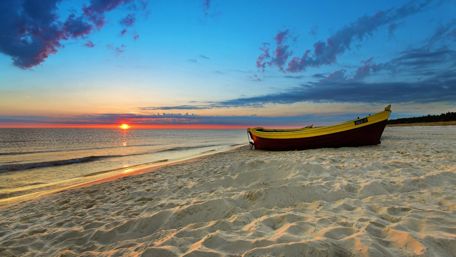 Boat on the sandy beach wallpaper