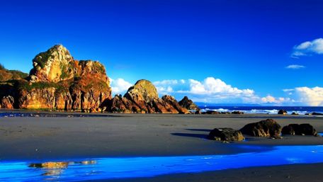 Blue sky over the beach wallpaper