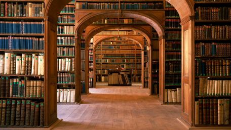 Library with antique books wallpaper