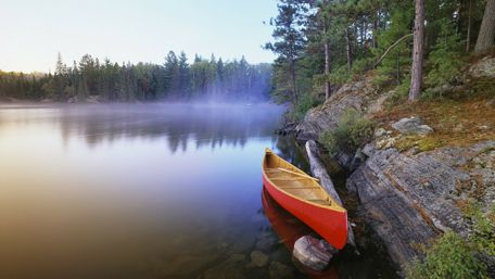 Canoe at the lakeside wallpaper