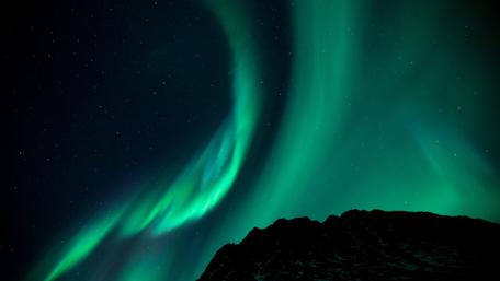 Aurora Borealis on the starry night sky wallpaper
