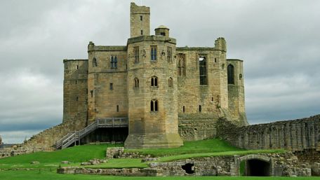 Majestic Castle Against a Cloudy Sky wallpaper