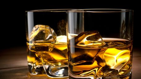 Golden Whisky Glasses with Ice Cubes Shine Brightly wallpaper