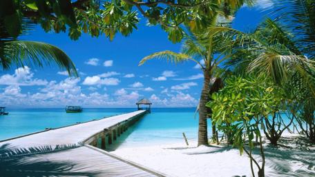 Long pier over the blue ocean in Maldives wallpaper
