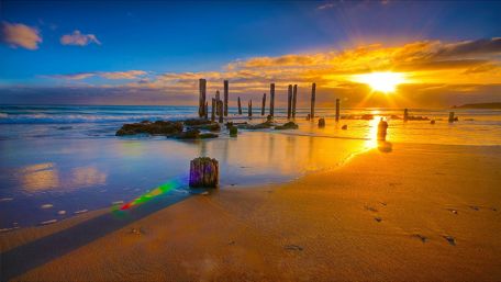 Sunset in the sandy beach wallpaper