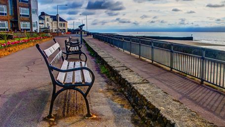 Serene Waterfront Benches Awaiting Company wallpaper