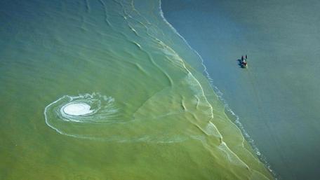 Amazing aerial photograph of a maelstrom wallpaper