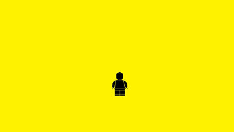 Tiny LEGO Man on Bright Yellow wallpaper
