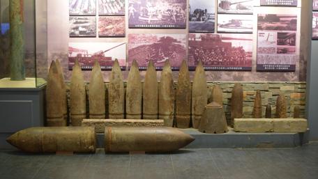 Historical Artillery Shells on Display in Museum wallpaper