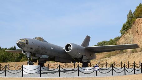 Military Aircraft Display in Natural Setting wallpaper
