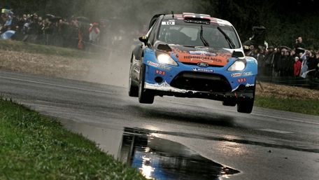 Thrilling Leap of the Ford Fiesta Rally Car wallpaper