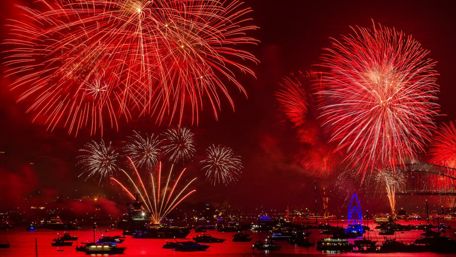 Red fireworks over the bay wallpaper