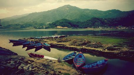 Mountain landscape with boats wallpaper