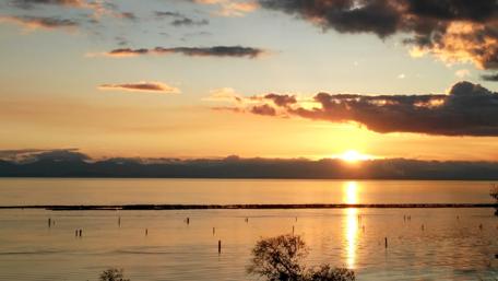 Serene Sunset Over Tranquil Waters wallpaper