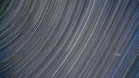 Celestial Dance of Star Trails wallpaper