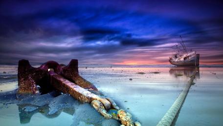 Anchored ship after tide wallpaper