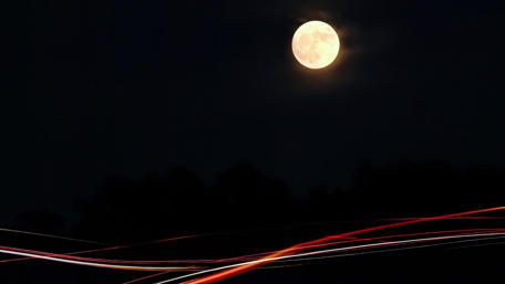 Glowing Moon Over Midnight Landscape wallpaper