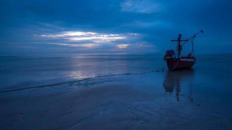 Fishing boat on the shore wallpaper