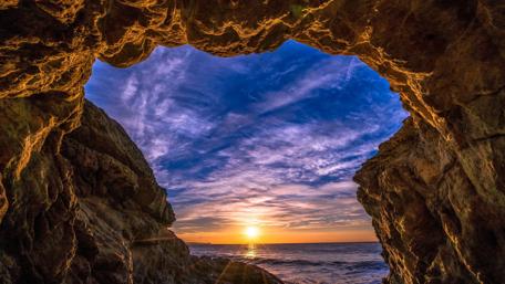 Sunset from a sea cave wallpaper