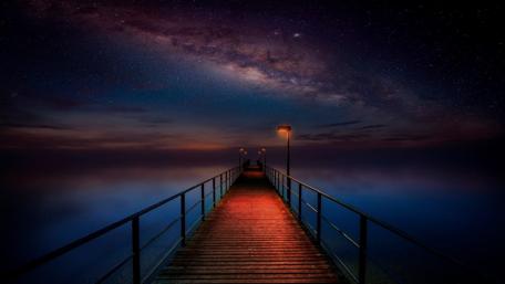 Long pier under the Milky Way wallpaper