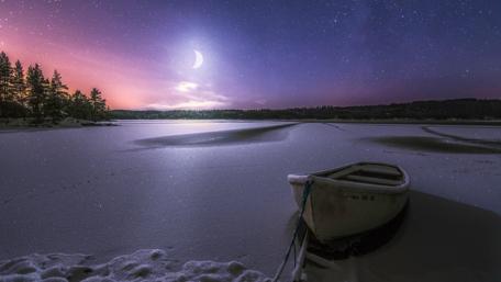 Boat on a frozen lake wallpaper