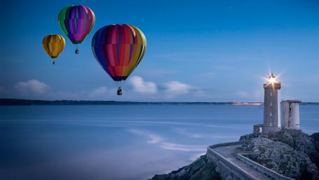 Breathtaking Morning Balloon Adventure Over the Water wallpaper