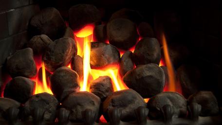 Cozy Fireplace with Glowing Flames and Hot Coals wallpaper