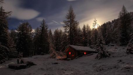 Cabin in the snowy forest wallpaper