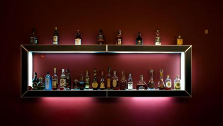 Stylish Bar Shelf with Exquisite Bottles wallpaper