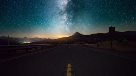Milky Way Over Serene Highway wallpaper