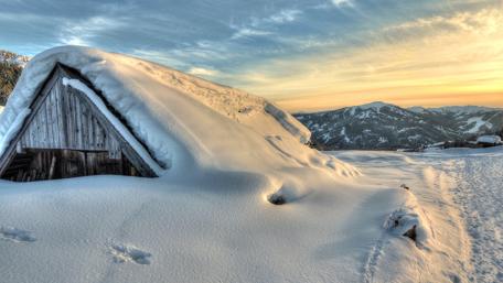 Snowcovered hut wallpaper