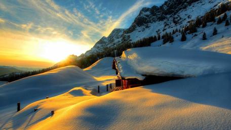 Snow-capped log cabin wallpaper