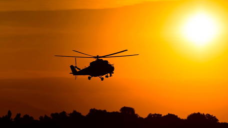 Elegant Helicopter Silhouette at Sunset for Aviation Lovers wallpaper