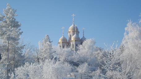 Winter with white trees and a church wallpaper