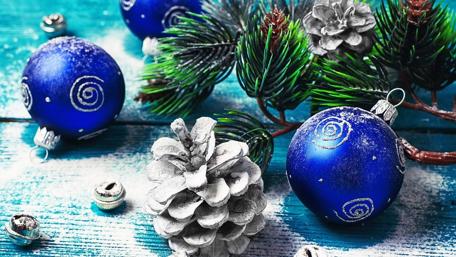 Blue Christmas Ornaments and Pinecones Festively Arranged wallpaper