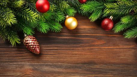 Festive Christmas Ornaments on Wood Background wallpaper