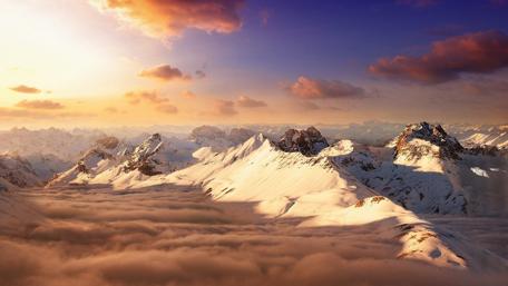 Mountain peaks above the clouds wallpaper