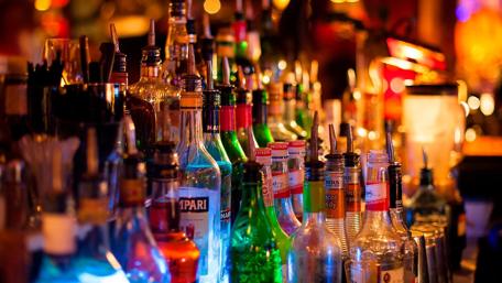 Vibrant Bar of Colorful Bottles wallpaper