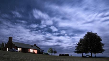 Serene Night Sky Over Tranquil House wallpaper