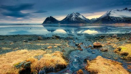 Majestic Vestrahorn Peaks Reflected in Tranquil Fjord Water wallpaper