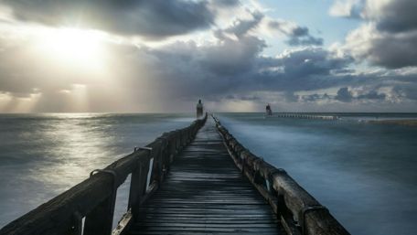 Serene Morning at the Pier Overlooking the Ocean wallpaper