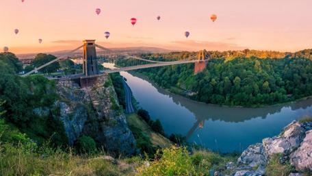 Hot Air Balloons Over River Bridge Landscape wallpaper