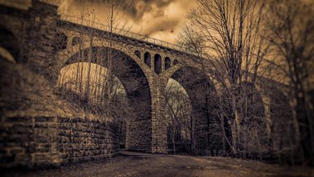 Forgotten Bridge in a Timeless Landscape wallpaper