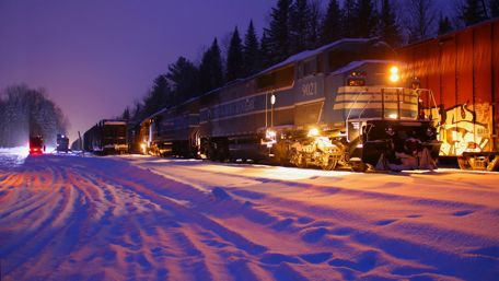 Winter Train at Night in the Snowy Landscape wallpaper