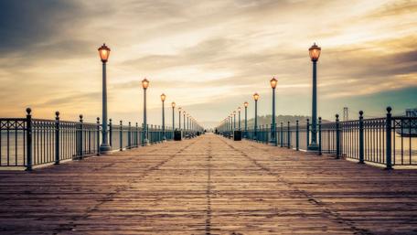 Peaceful Pier at Sunrise Over the Ocean wallpaper