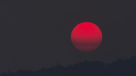 Red Eclipse Over a Dark Horizon wallpaper