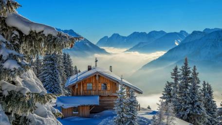 Winter Retreat in a Snowy Mountain Scene wallpaper