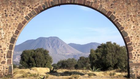 Serene Mountain View Framed by an Arch wallpaper